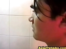 Asian twunk enjoys stroking his unshaven shaft in bathroom